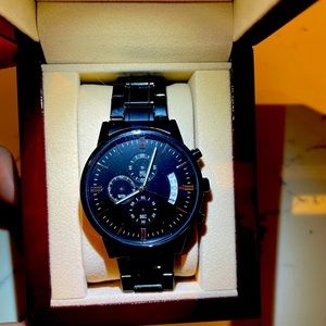 Fancy scratch proof and water proof watch brand new. Has engraving.
